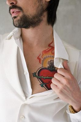 Man Showing Tatoo on Chest