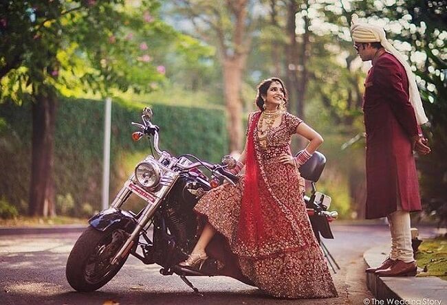pre wedding couple poses for photoshoot on bike