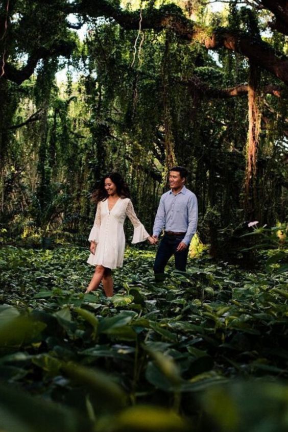 romantic wedding couple poses in the forest